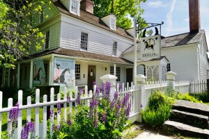 Keeler Tavern Museum and History Center's historic building on a summer afternoon.