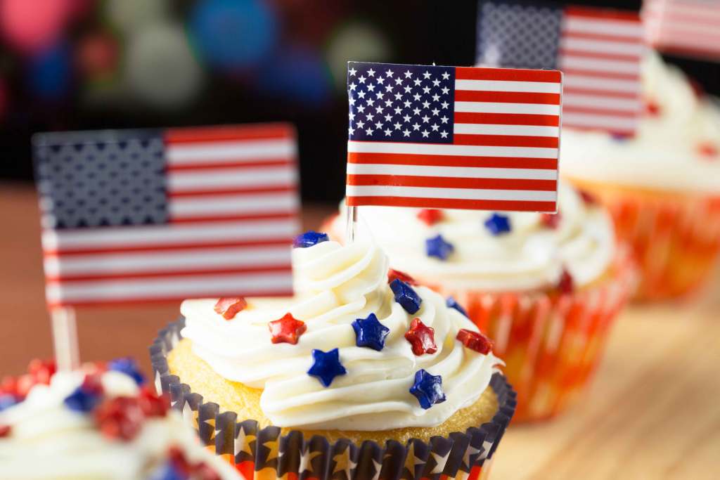 Patriotic cupcakes with American Flag decorations.