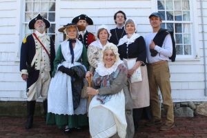 Men and women in historical dress to give the tours
